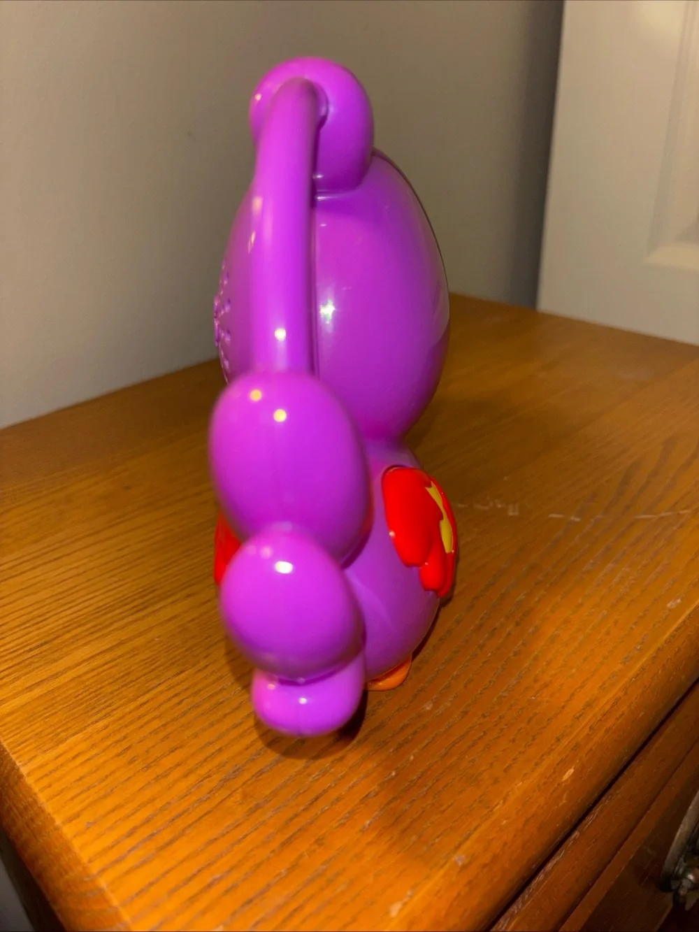 Fisher-Price Vibrant Purple Parrot Toy with Yellow Beak works great